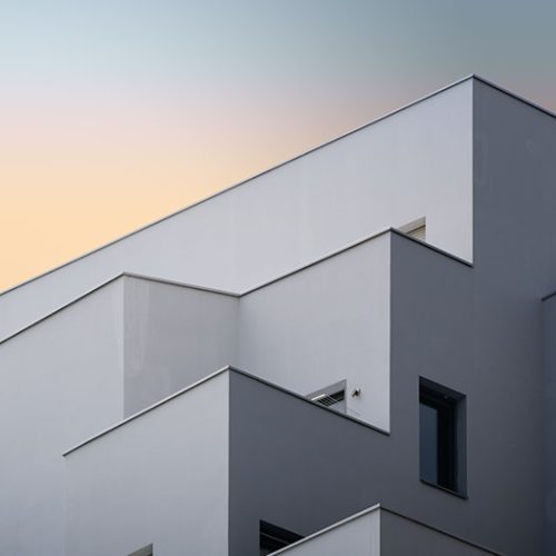 A vertical low angle shot of a white concrete building captured in Massy, France